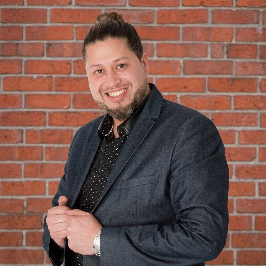 Portrait of Angel Arturo Morales, a professional stylist at Luxor Hair Studio, showcasing their expertise and style.