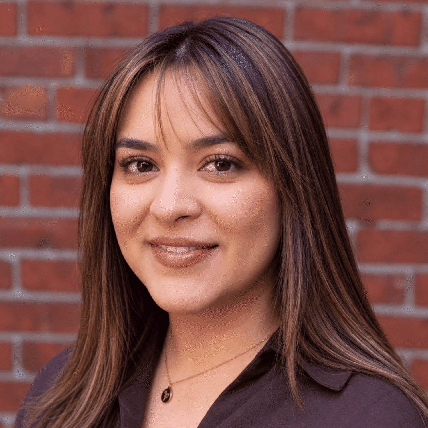 Portrait of Giselle Lopez, a professional stylist at Luxor Hair Studio, showcasing their expertise and style.