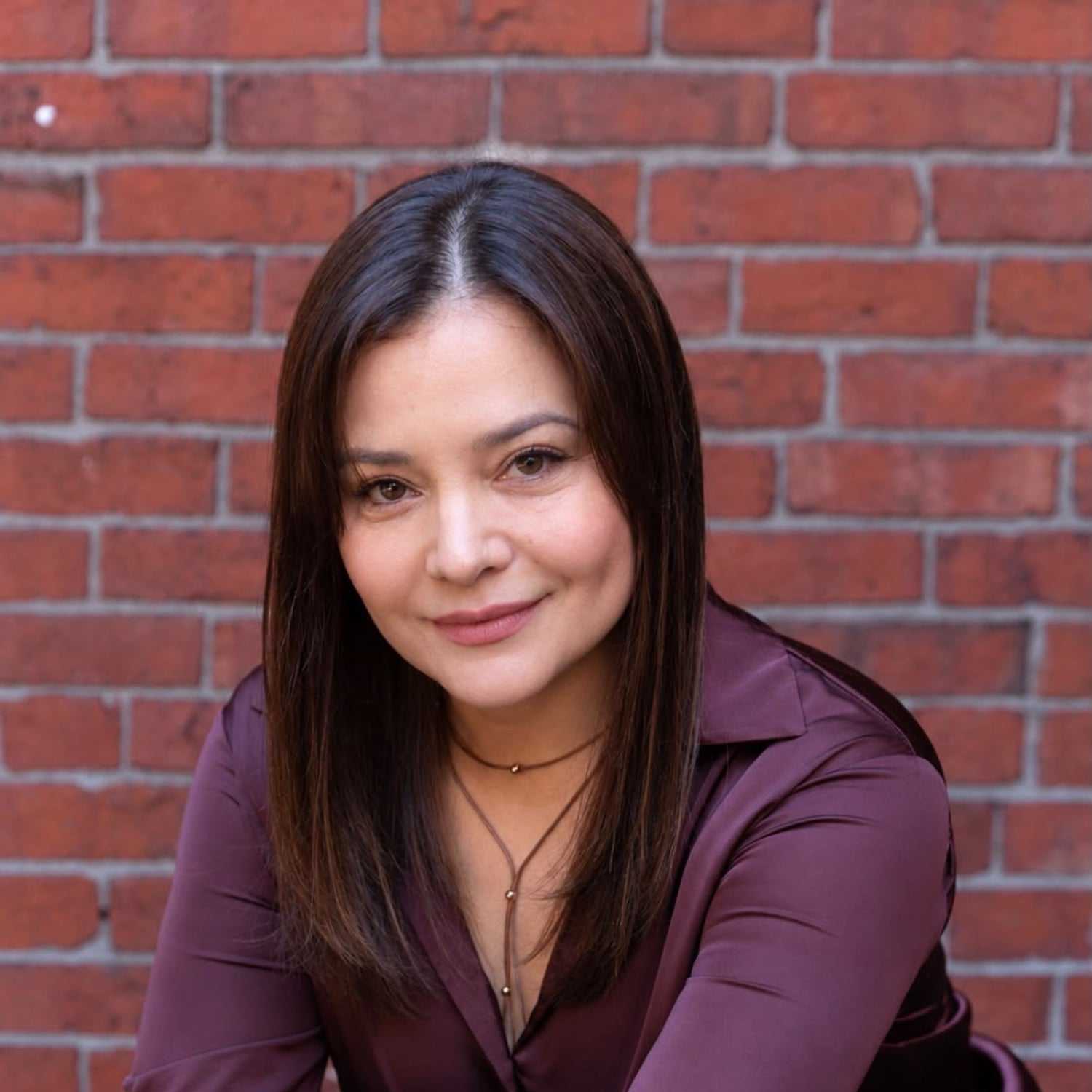 Portrait of Angie Smith, a professional stylist at Luxor Hair Studio, showcasing their expertise and style.